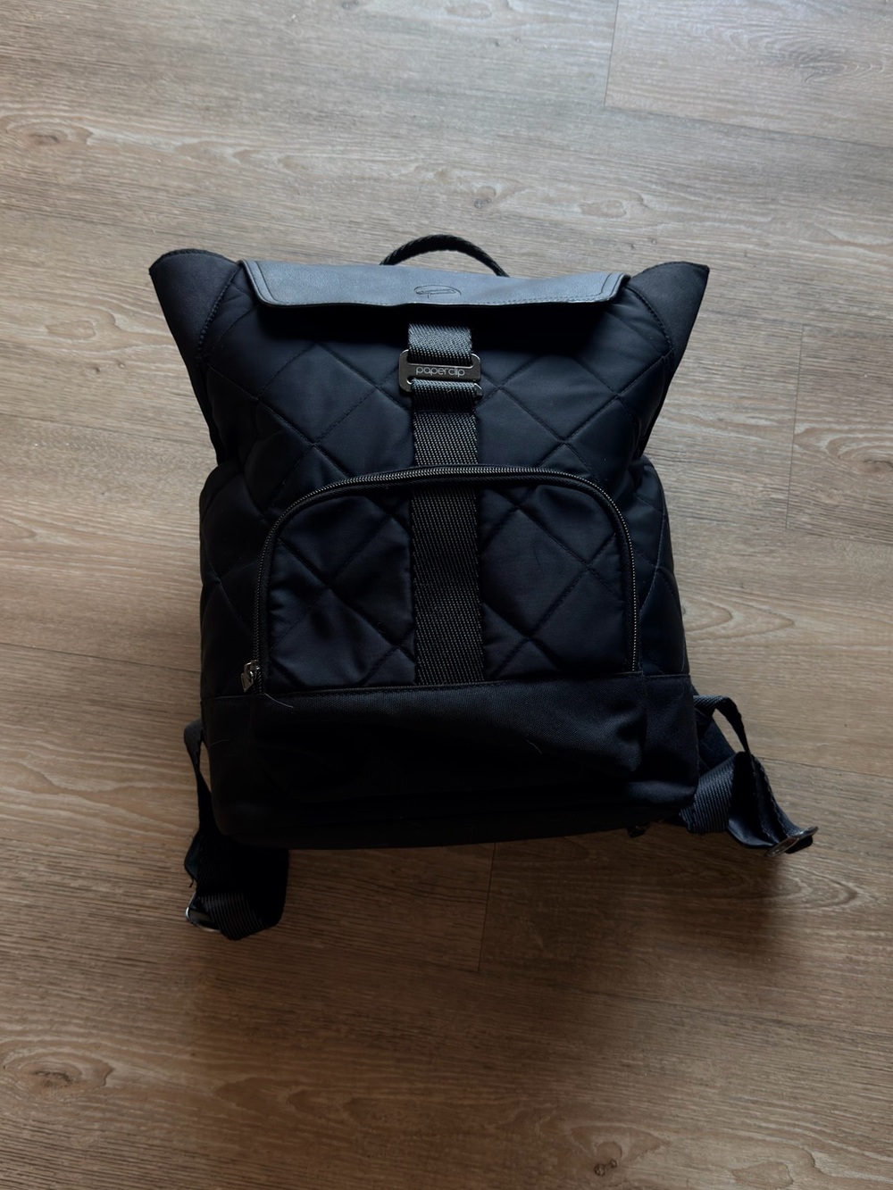 Black Quilted Roll-Top Backpack - [Brand]